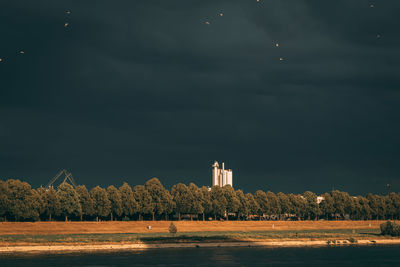 Scenic view of sea and buildings against sky