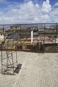 View of city by sea against sky