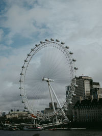 Low angle view of ferris wheel against sky