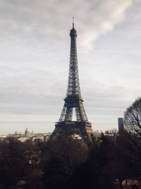 Low angle view of tower against cloudy sky