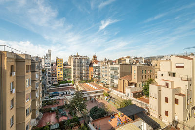 Buildings in city against sky