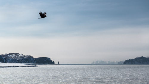 Scenic view of bay against sky