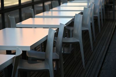 High angle view of empty chairs and table