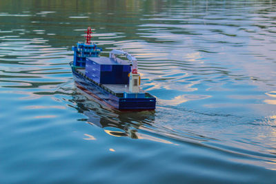 High angle view of boat floating on lake