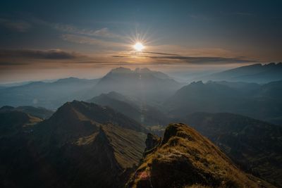 Scenic view of mountains against sky during sunset