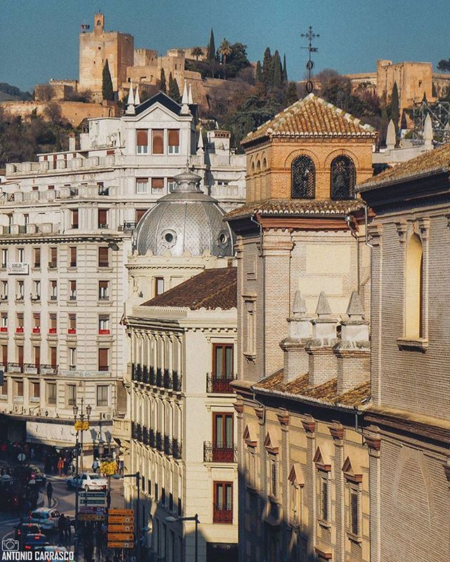 building exterior, architecture, built structure, city, residential structure, residential building, residential district, church, old town, travel destinations, town, place of worship, cityscape, high angle view, roof, religion, history, dome, sky