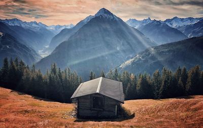 Scenic view of trees and mountains against sky