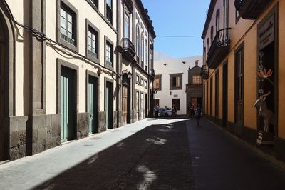 Narrow alley amidst buildings in city