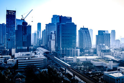 Modern buildings in city against sky