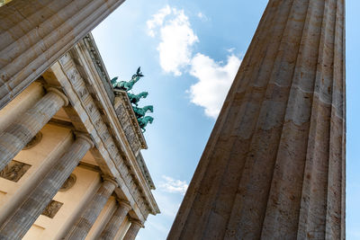 Low angle view of brabdemburg gate in berlin against sky