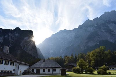 Panoramic shot of building and mountains against sky