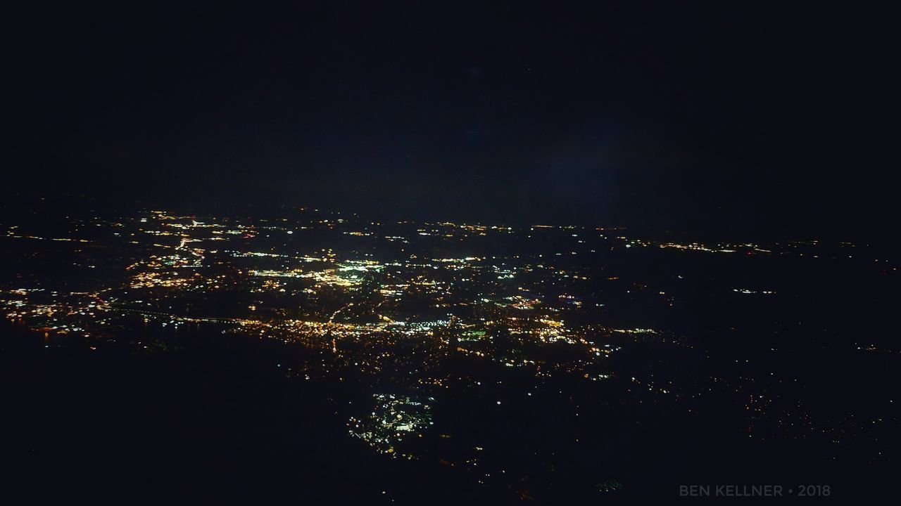 illuminated, cityscape, architecture, building exterior, city, night, built structure, sky, no people, nature, building, aerial view, copy space, outdoors, residential district, opportunity, high angle view, scenics - nature, clear sky