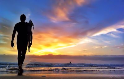 Silhouette of people on beach