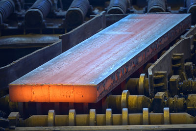 High angle view of plank on equipment in factory