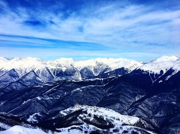 Scenic view of snowcapped mountains against sky