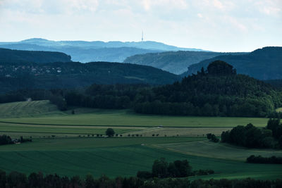 Scenic view of landscape and mountains against sky