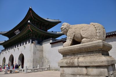 Low angle view of statue against sky