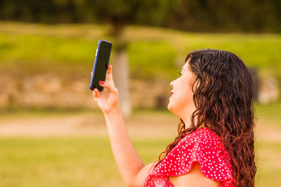 Young woman using mobile phone