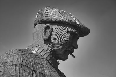 Low angle view of statue against sky