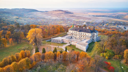 High angle view of trees and buildings during autumn