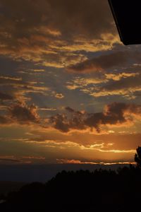 Silhouette of trees against sky during sunset