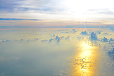 Sunlight streaming through clouds during sunset