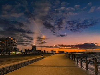 Bridge over river against sky during sunset