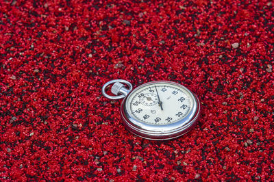 Close-up of stopwatch on field