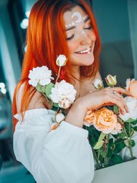 Close-up of woman holding rose bouquet