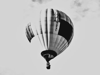 Low angle view of hot air balloon flying against sky