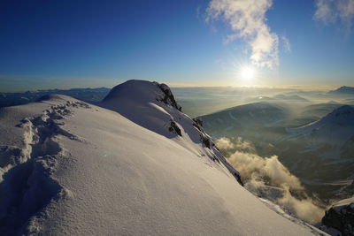 Scenic view of mountains against sky during winter