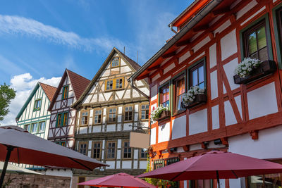 Facades of half-timbered houses in schmalkalden, thuringia and parasols in the foreground