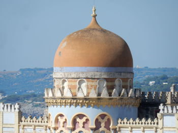 Exterior of temple against buildings in city