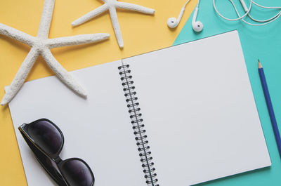 High angle view of pen and book on table