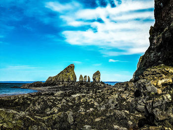 Scenic view of sea against cloudy sky