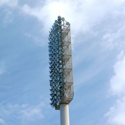 Low angle view of communications tower against sky