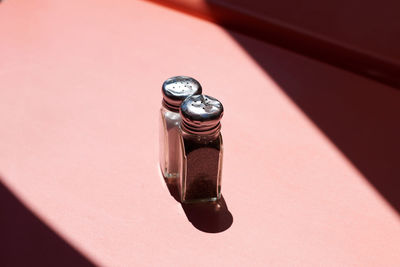 High angle view of slat shakers on table