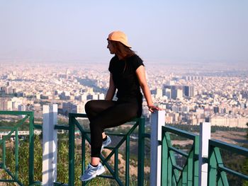 Young woman looking at cityscape