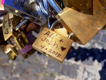 Close-up of padlocks hanging on metal