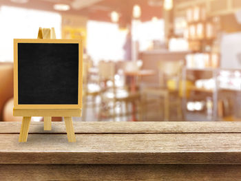Close-up of blackboard on table