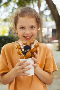 Portrait of a girl eating ice cream