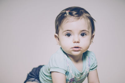 Portrait of cute baby girl at home