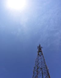 Low angle view of communications tower against sky