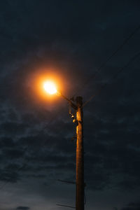 Low angle view of street light against sky