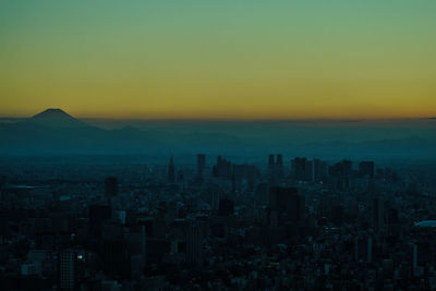 High angle view of city at sunset