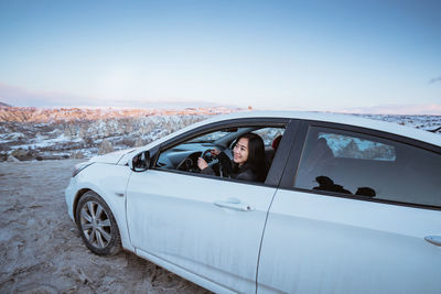 Car on road against clear sky