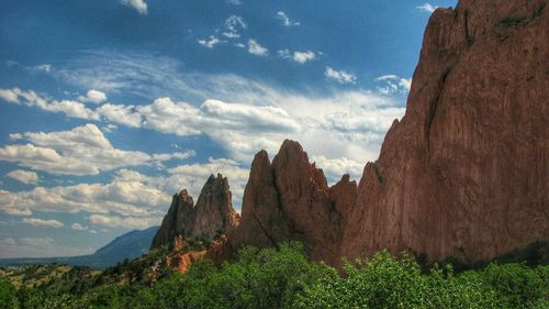 Scenic view of mountains against cloudy sky