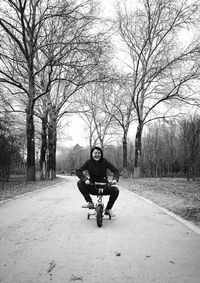 Man riding motorcycle on road at park
