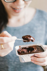 Midsection of woman having food