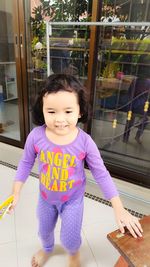 Cute girl standing at home